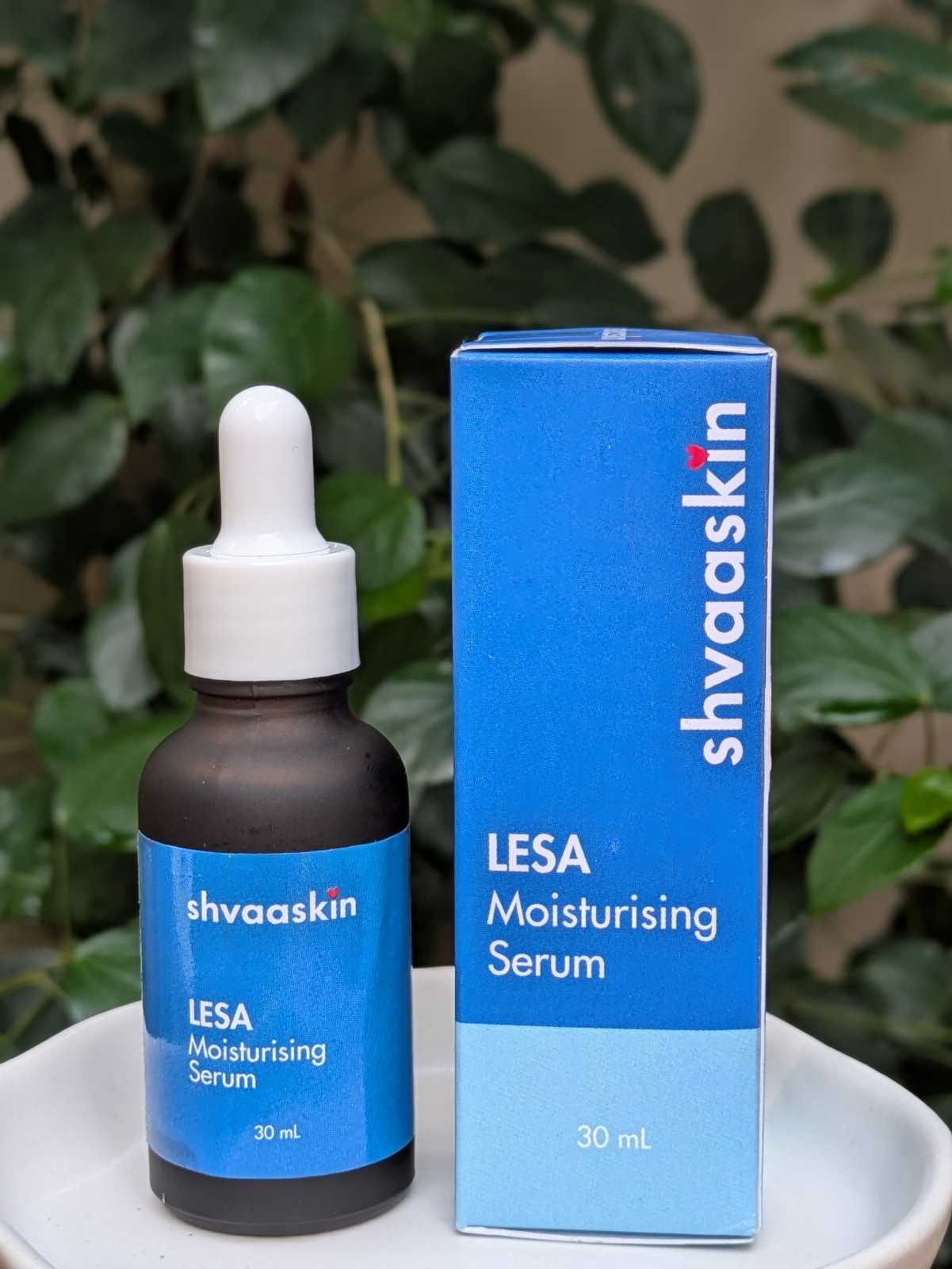 Shvaaskin LESA Moisturising Serum bottle and packaging on a green leafy background
